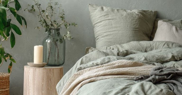 Calm sage green bedroom with tidy bed and empty floor space for ADHD mums 5 minute reset routine